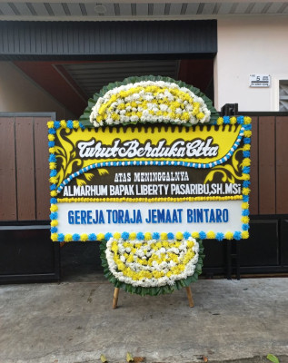 Papan Bunga Duka di Honipopu